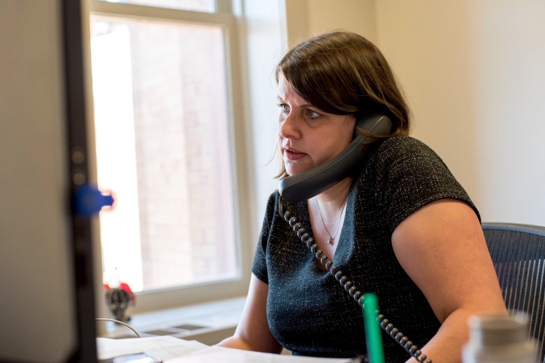 Claire Woodall-Vogg, executive director of the Milwaukee Election Commission, speaks on the phone from her office at City Hall.