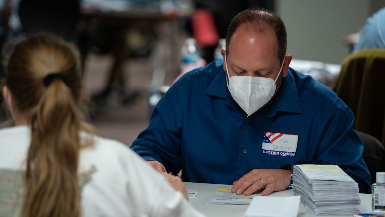 Election workers count ballots at the Milwaukee Central Count location after the polls had closed for the evening on Nov. 3, 2020.